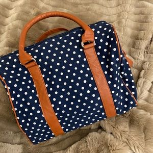 Navy blue white polka dot shoulder purse.